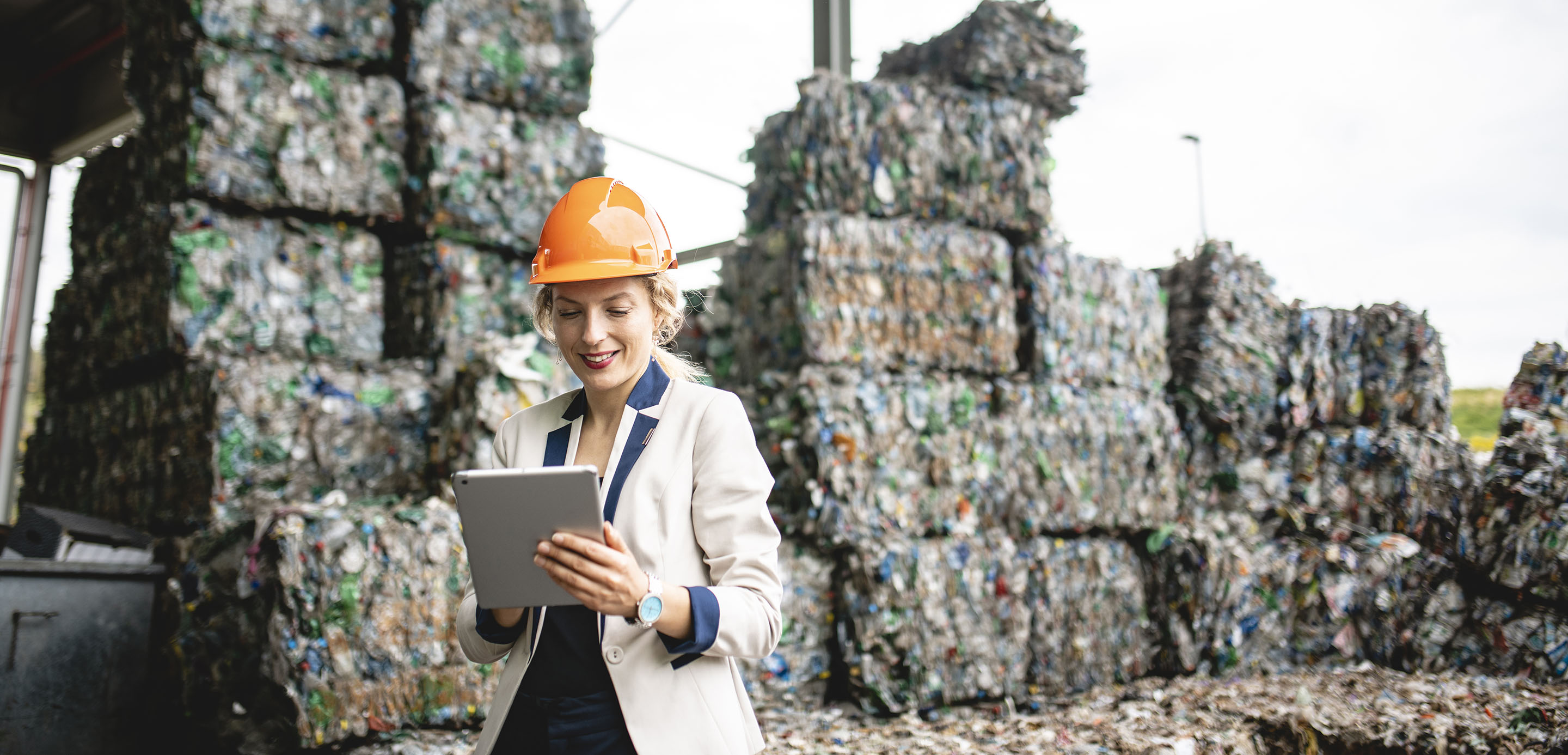 Woman at a large recycling plant Woman at a large recycling plant