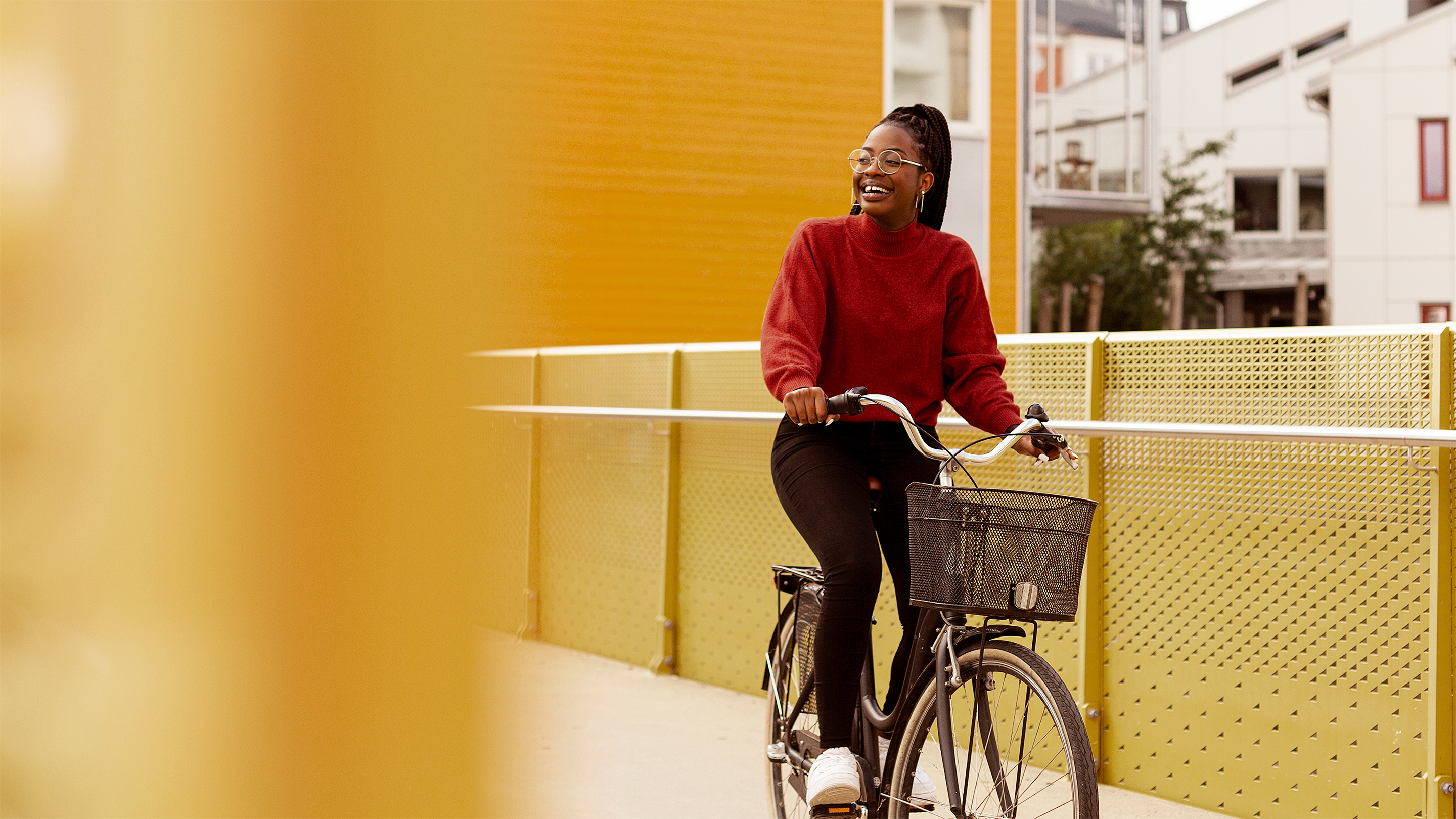 Smiling woman riding a bike 