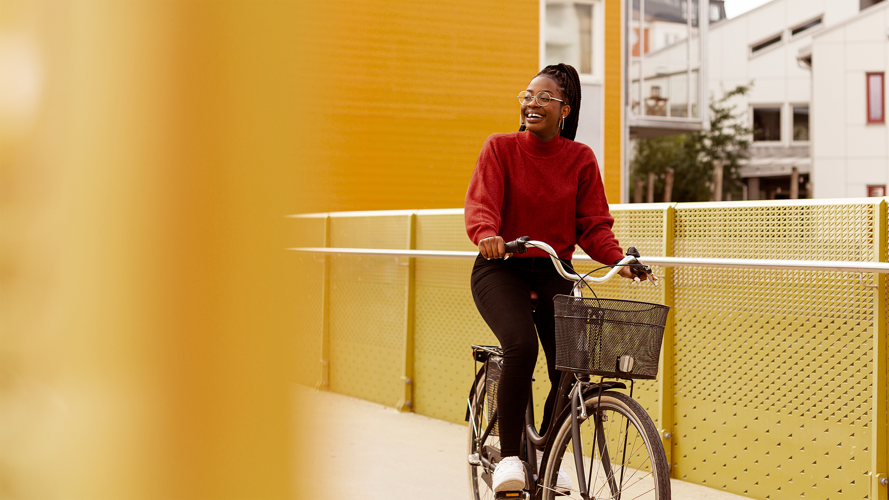Smiling woman riding a bike Smiling woman riding a bike